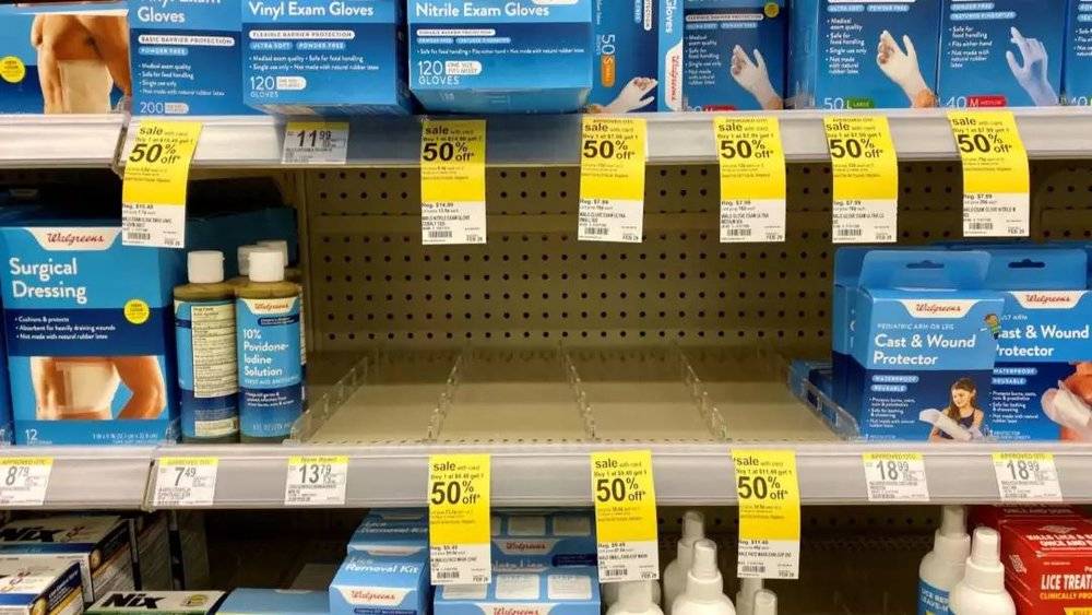 Pharmacy shelf empty of masks